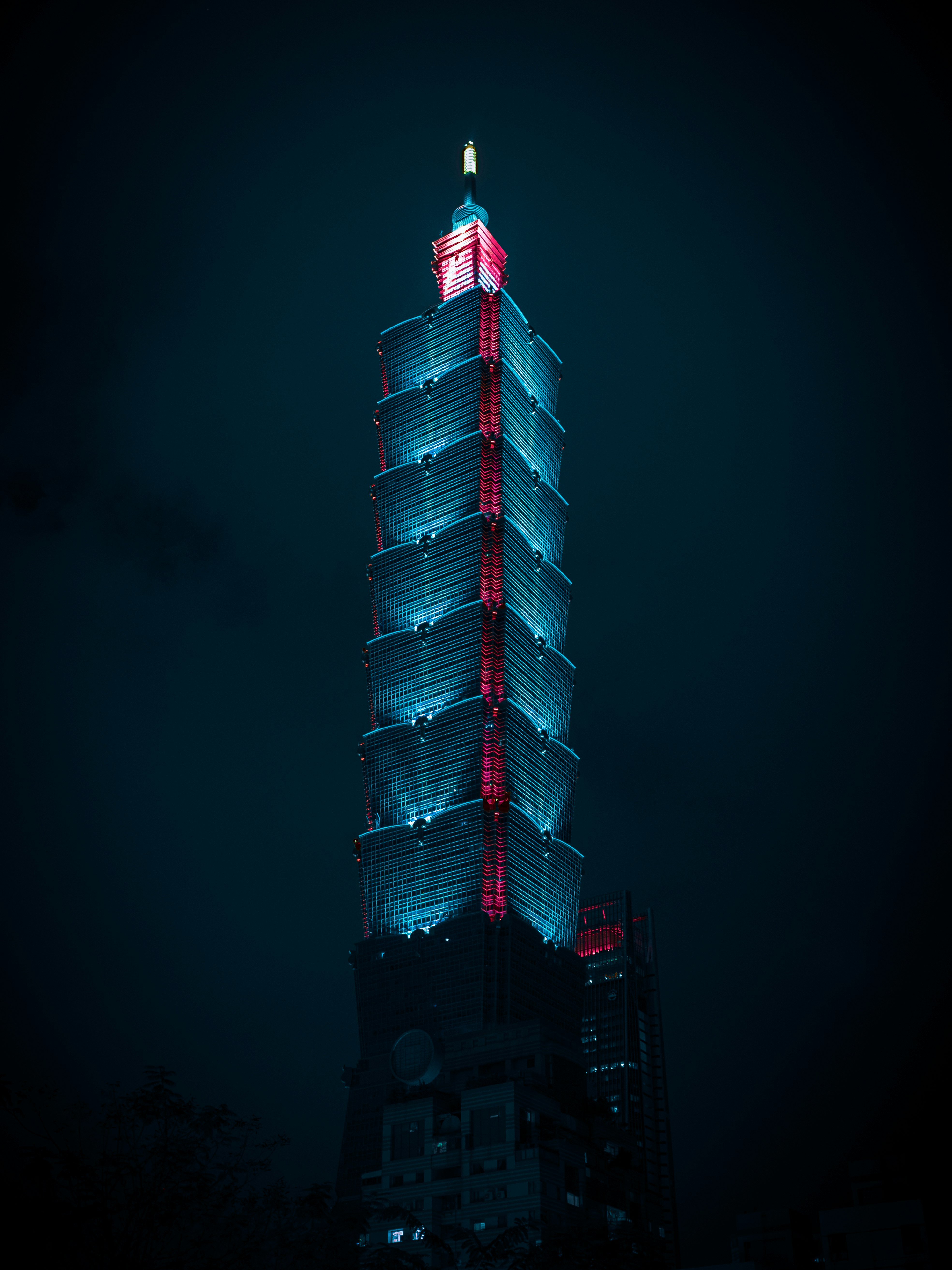red and white tower during night time